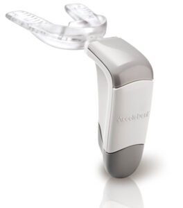 The Acceledent Aura pulse vibration device is used for accelerated Invisalign treatment.