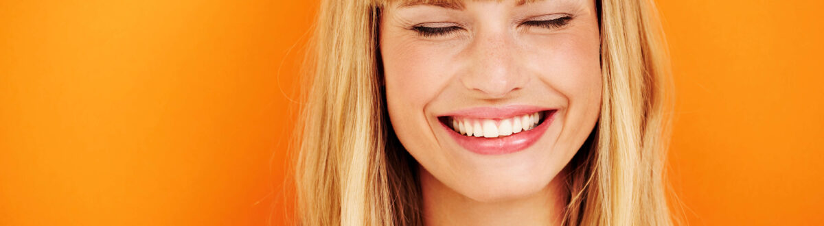 Young blond woman laughing