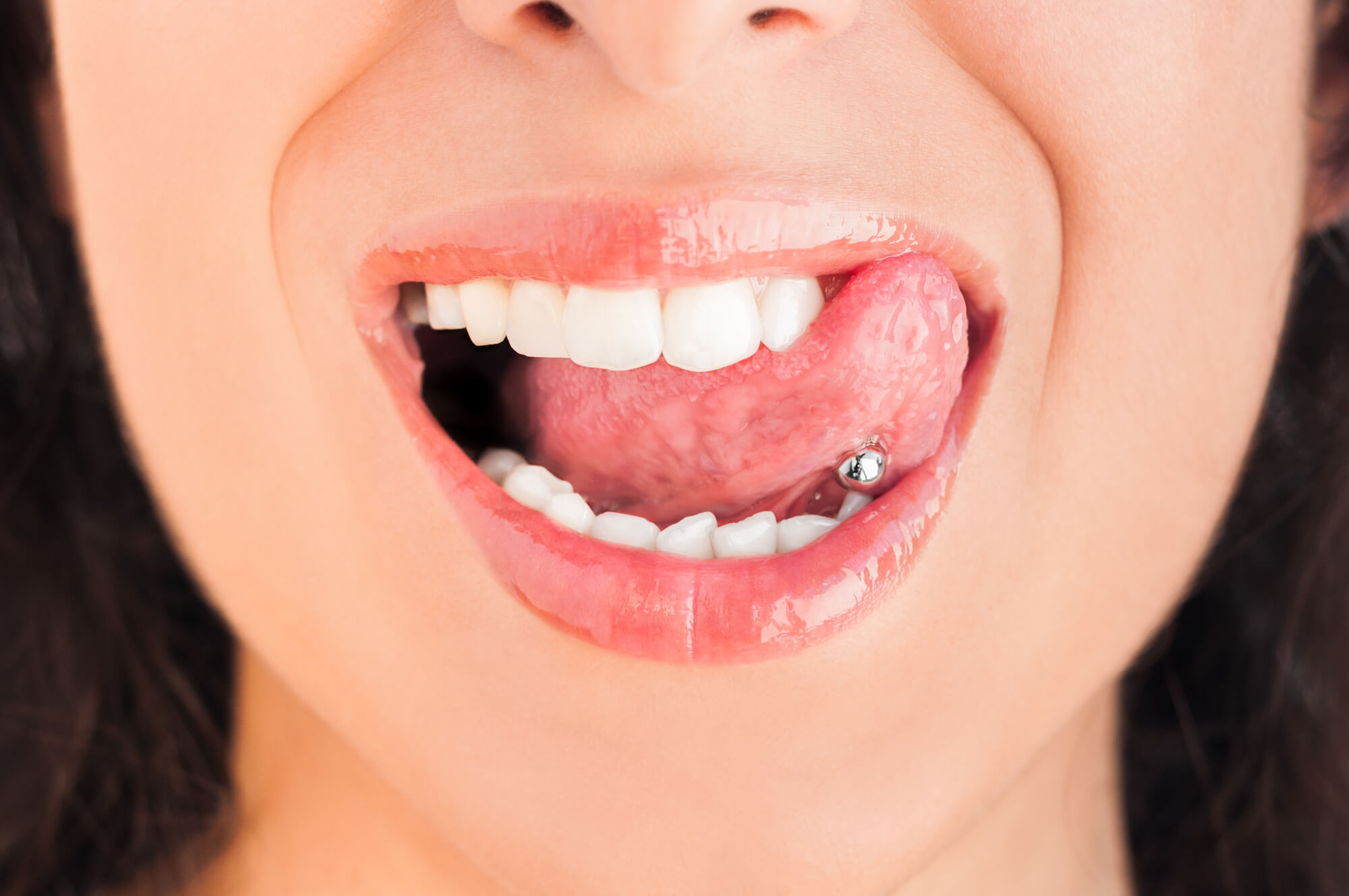 tongue piercings cause gum recession