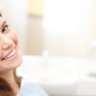 Smiling patient sitting on the dentist chair